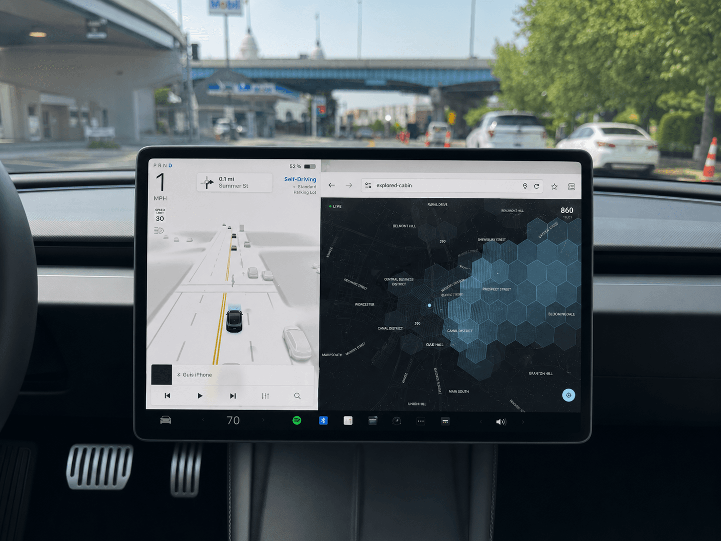 Explored's Cabin View on a Tesla's center screen, with the live coverage map beside the car's navigation.