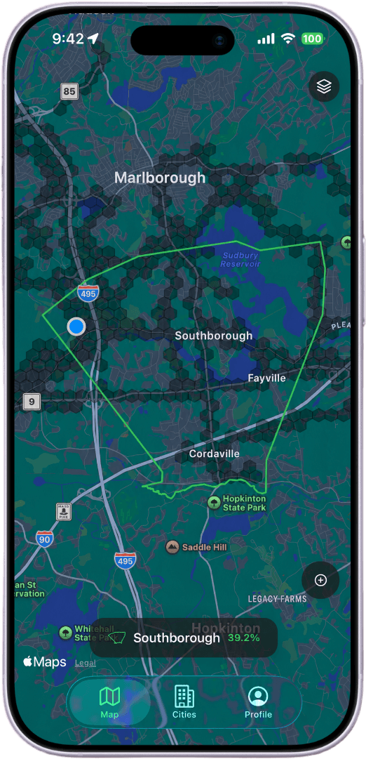 The Explored app showing a map with explored streets filled in tile by tile around your location.