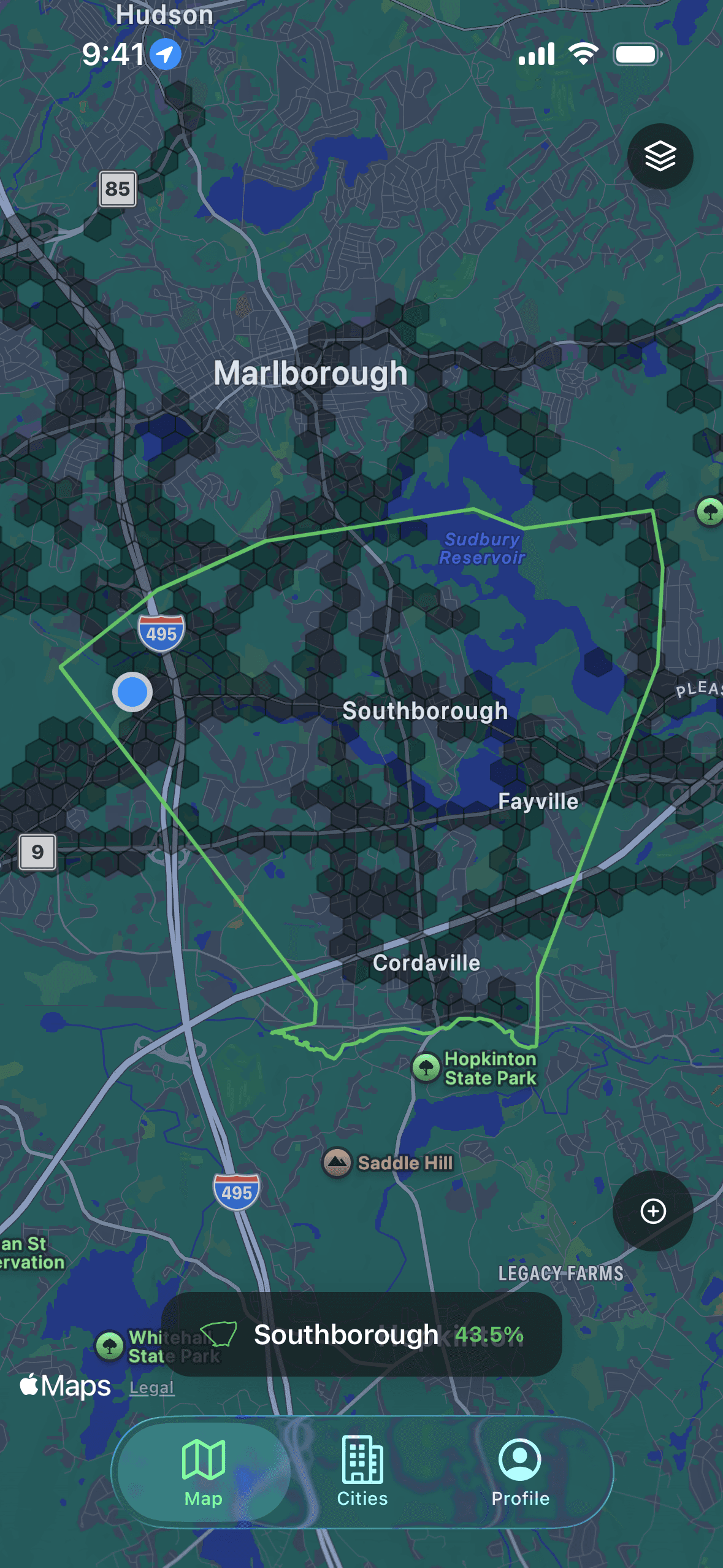 Explored's map view with a town outlined and its streets filled in tile by tile, showing 43.5% coverage.